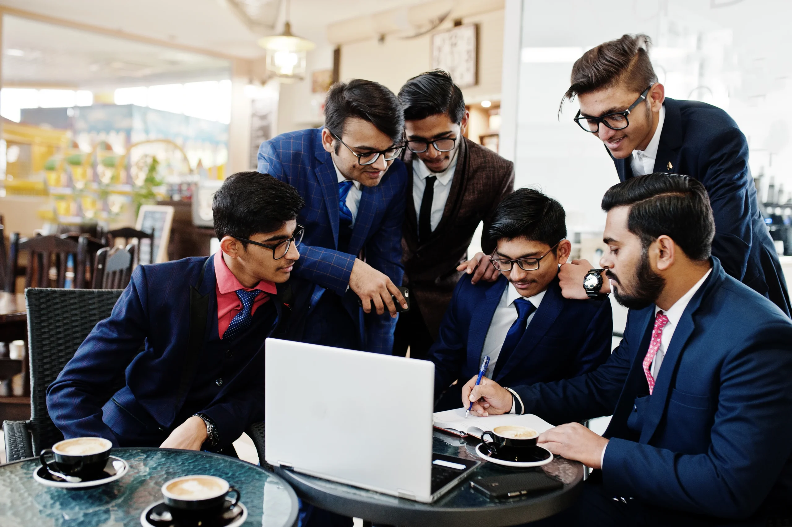 collaborative-process-indian-business-mans-brainstorming-meeting-officediverse-team-young-people-dressed-suits-cooperating-developing-common-project